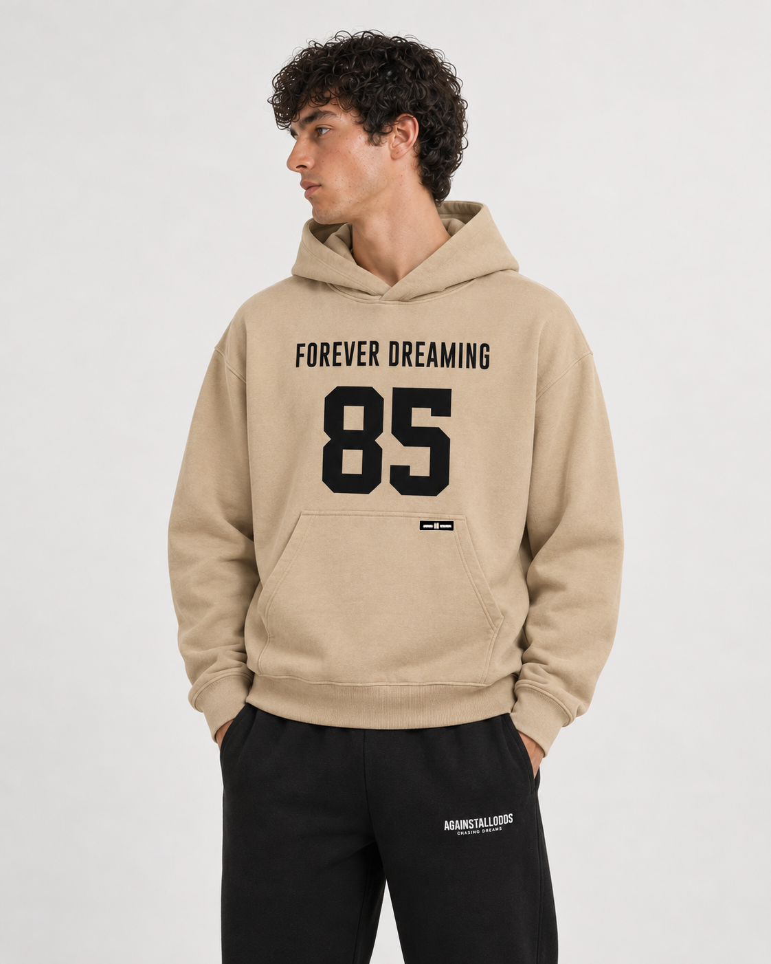 AI-generated styling illustration: 85 Coffee Luxury Hoodie with AAO black sweatpants, closer view.