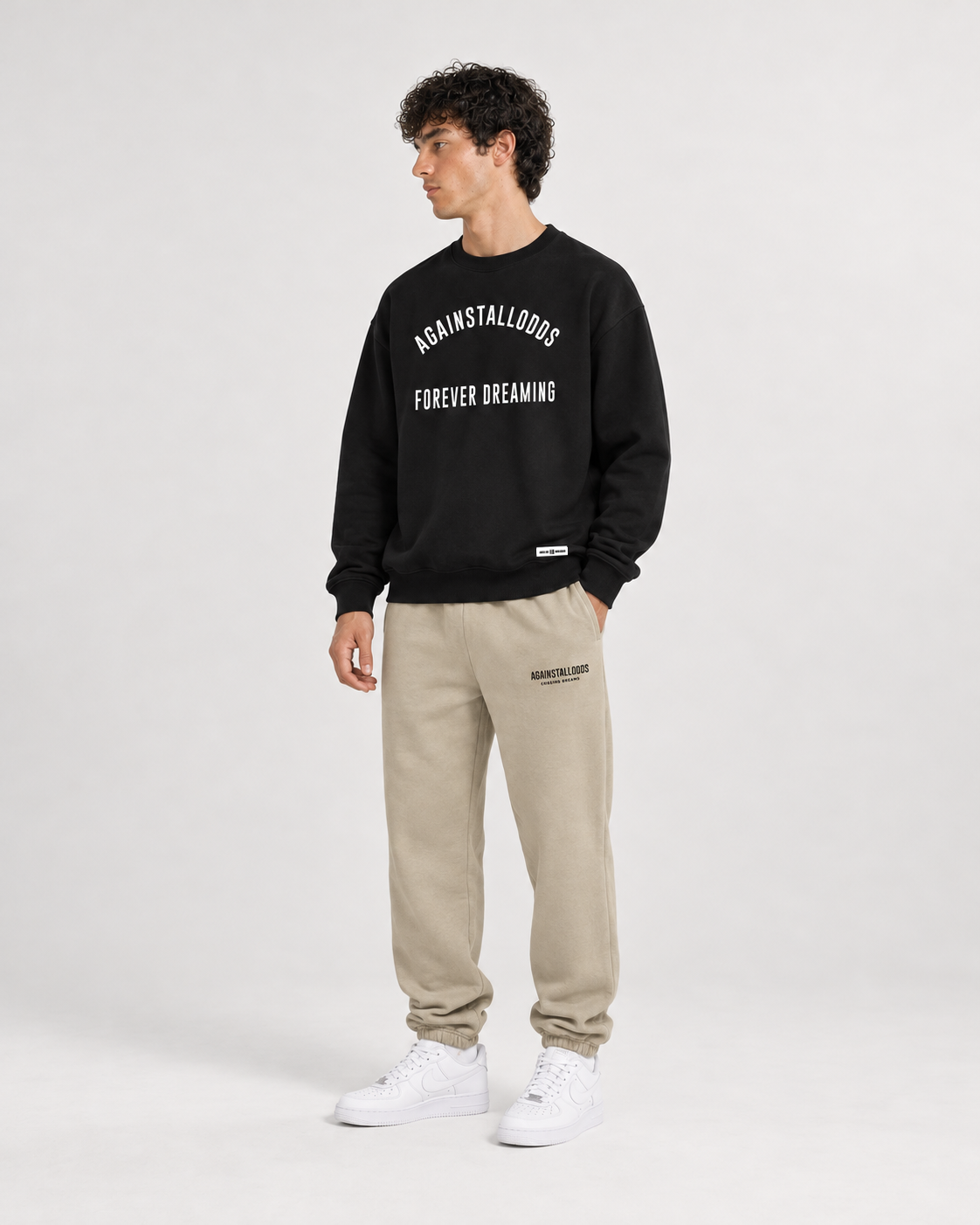 AI-generated styling illustration: AAO College Black Luxury Sweatshirt with AAO Sandune sweatpants, front view.