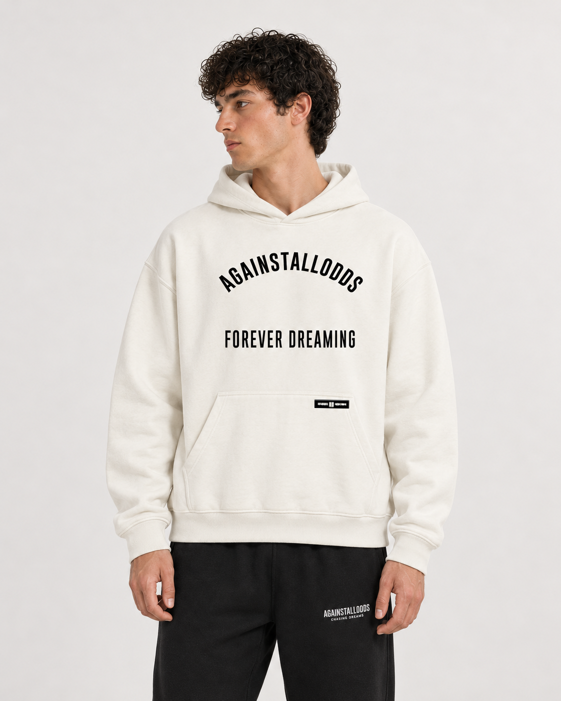 AI-generated styling illustration: AAO College Ivory Luxury Hoodie with AAO black sweatpants, closer view.