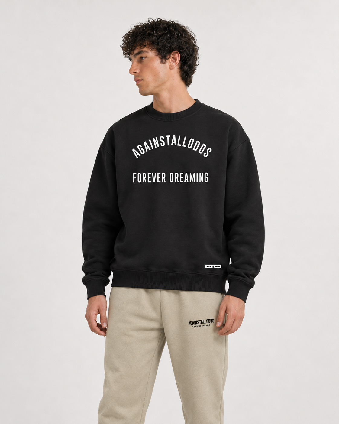 AI-generated styling illustration: AAO College Black Luxury Sweatshirt with AAO Sandune sweatpants, closer view.