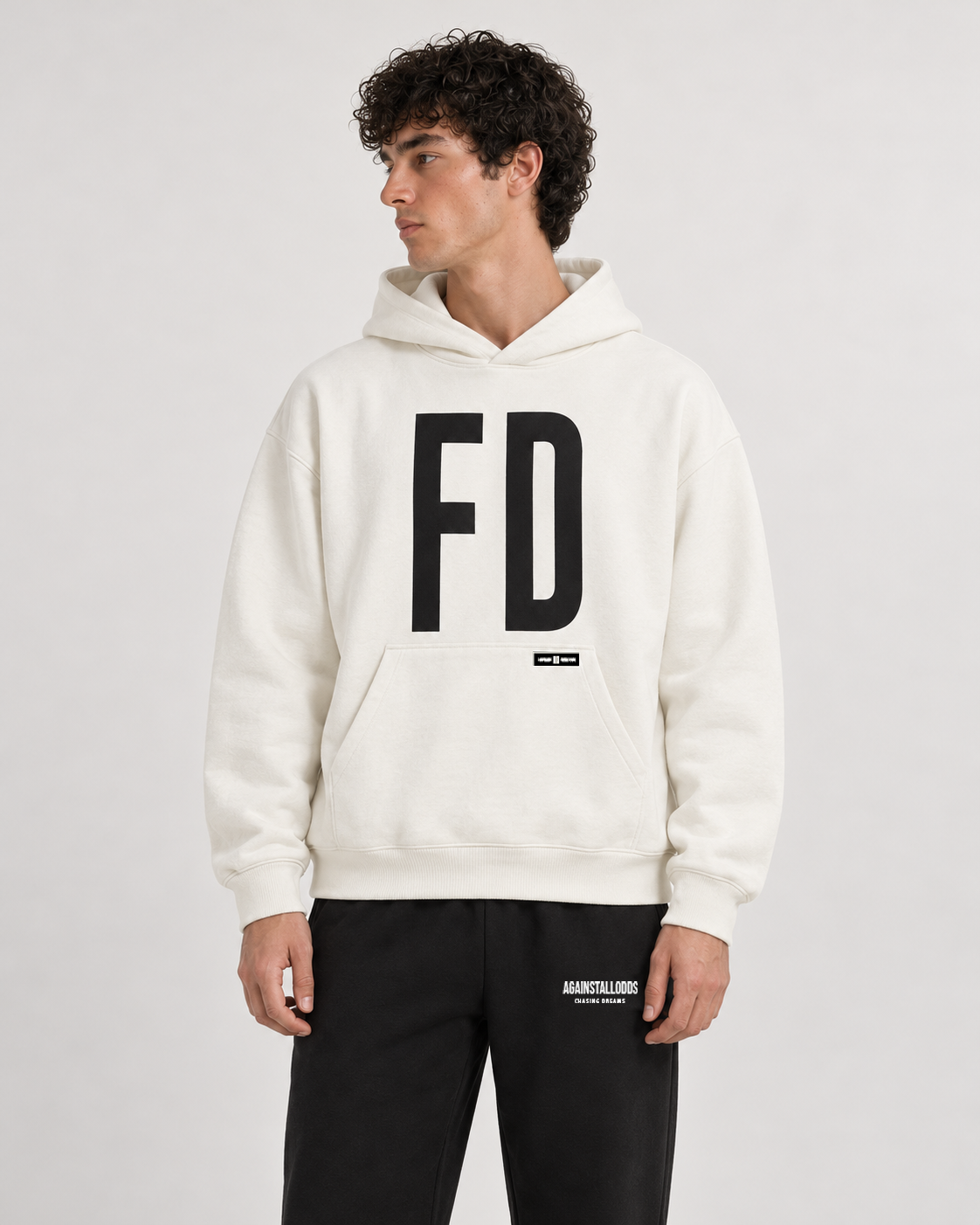 AI-generated styling illustration: AAO FD Ivory Luxury Hoodie with AAO black sweatpants, closer view.