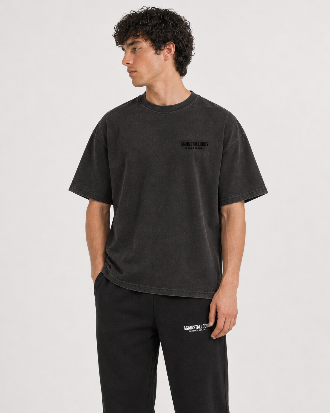 AI-generated styling illustration: Dreamers distressed luxury boxy tee with AAO black sweatpants, closer view.